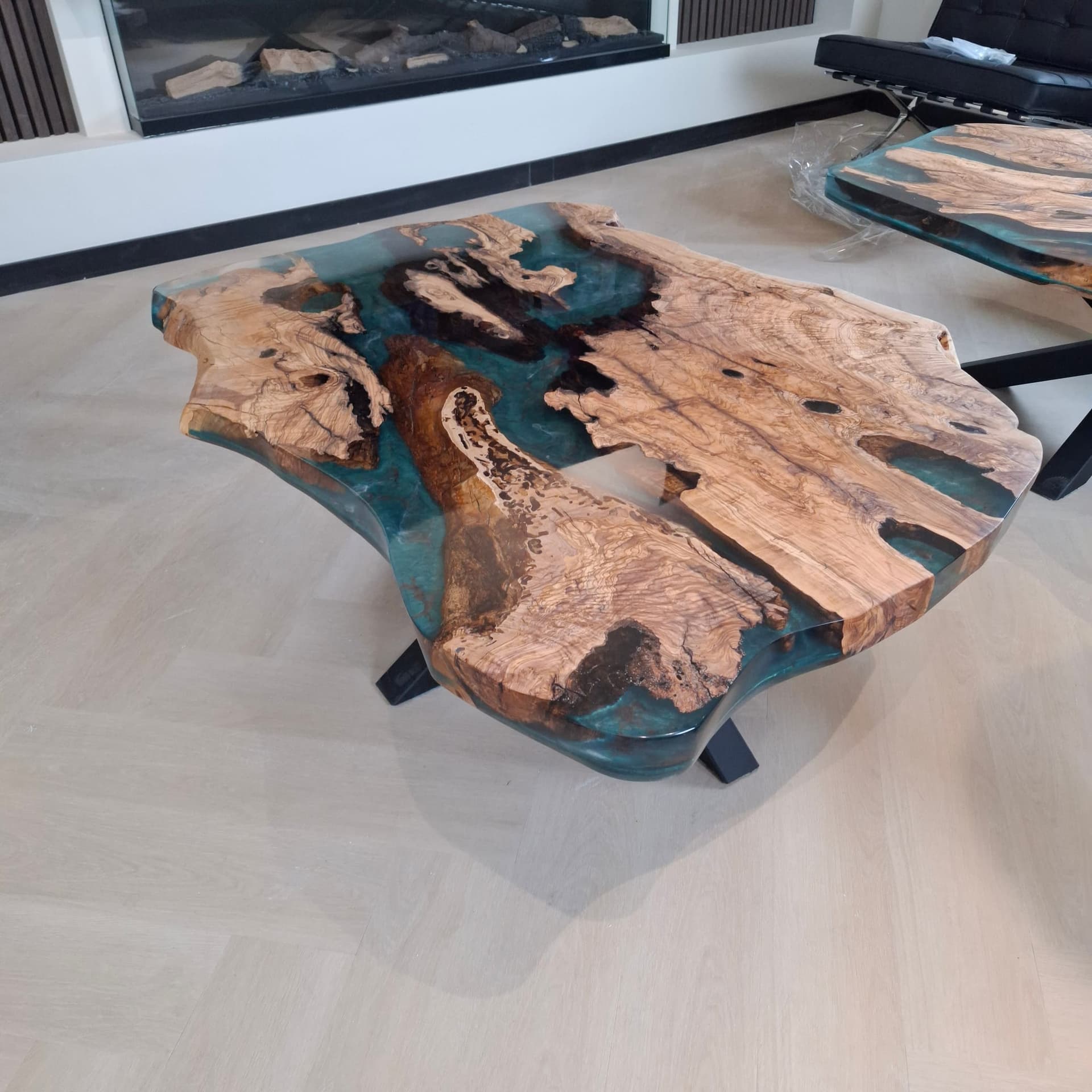 Olive-wood coffee table with blue-green epoxy